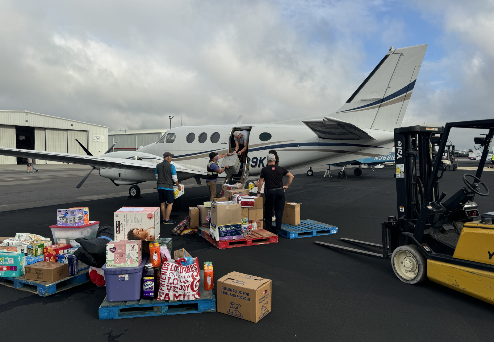 Loading critical supplies into an aircraft in North Carolina during Operation He